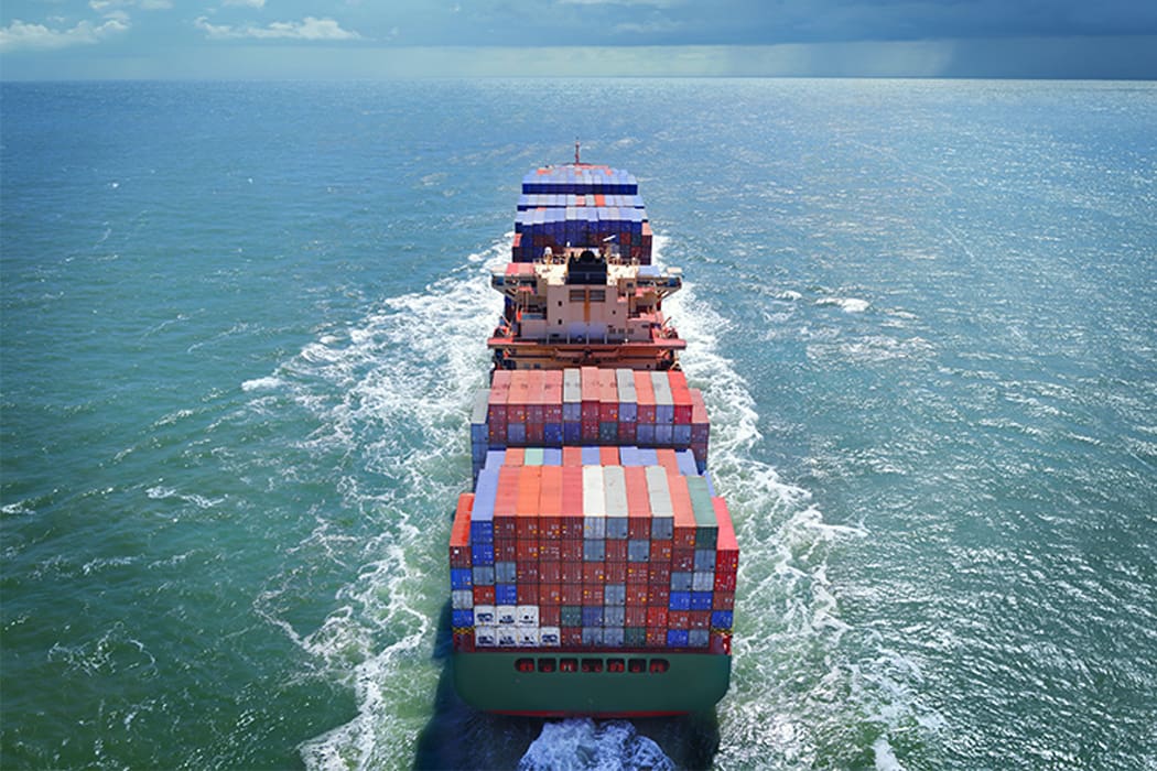 Container ship at sea with exported cargo